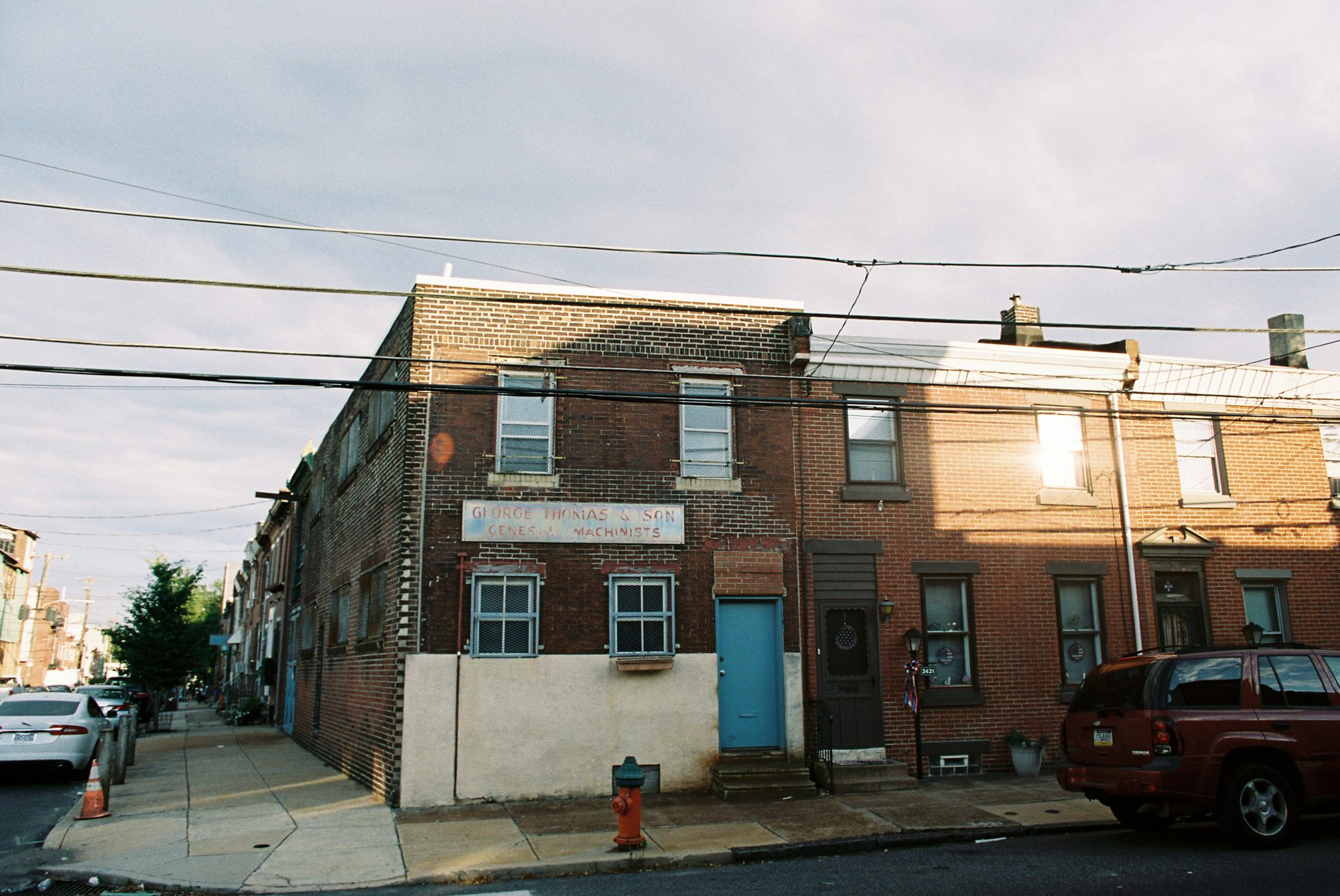 Philadelphia rowhomes with a rainbow overhead